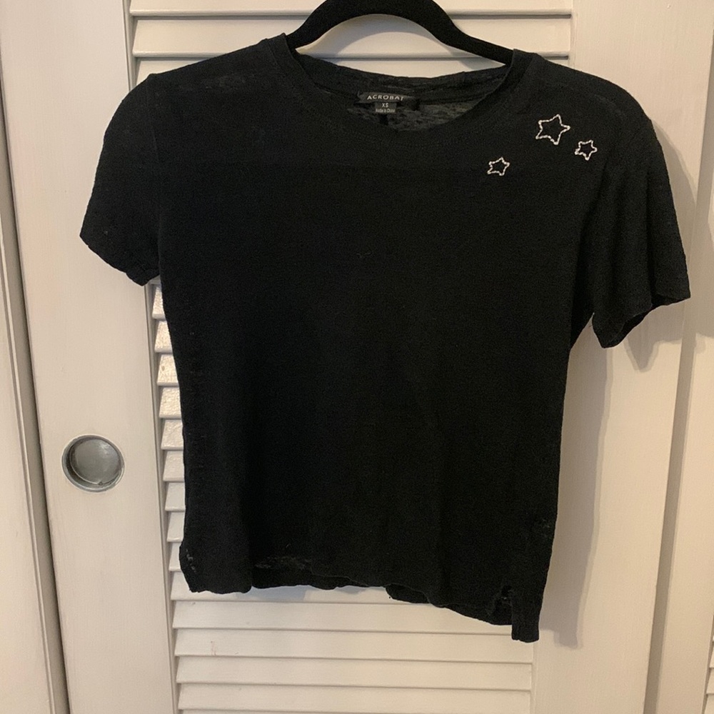 Black shirt, see through a bit, runs small